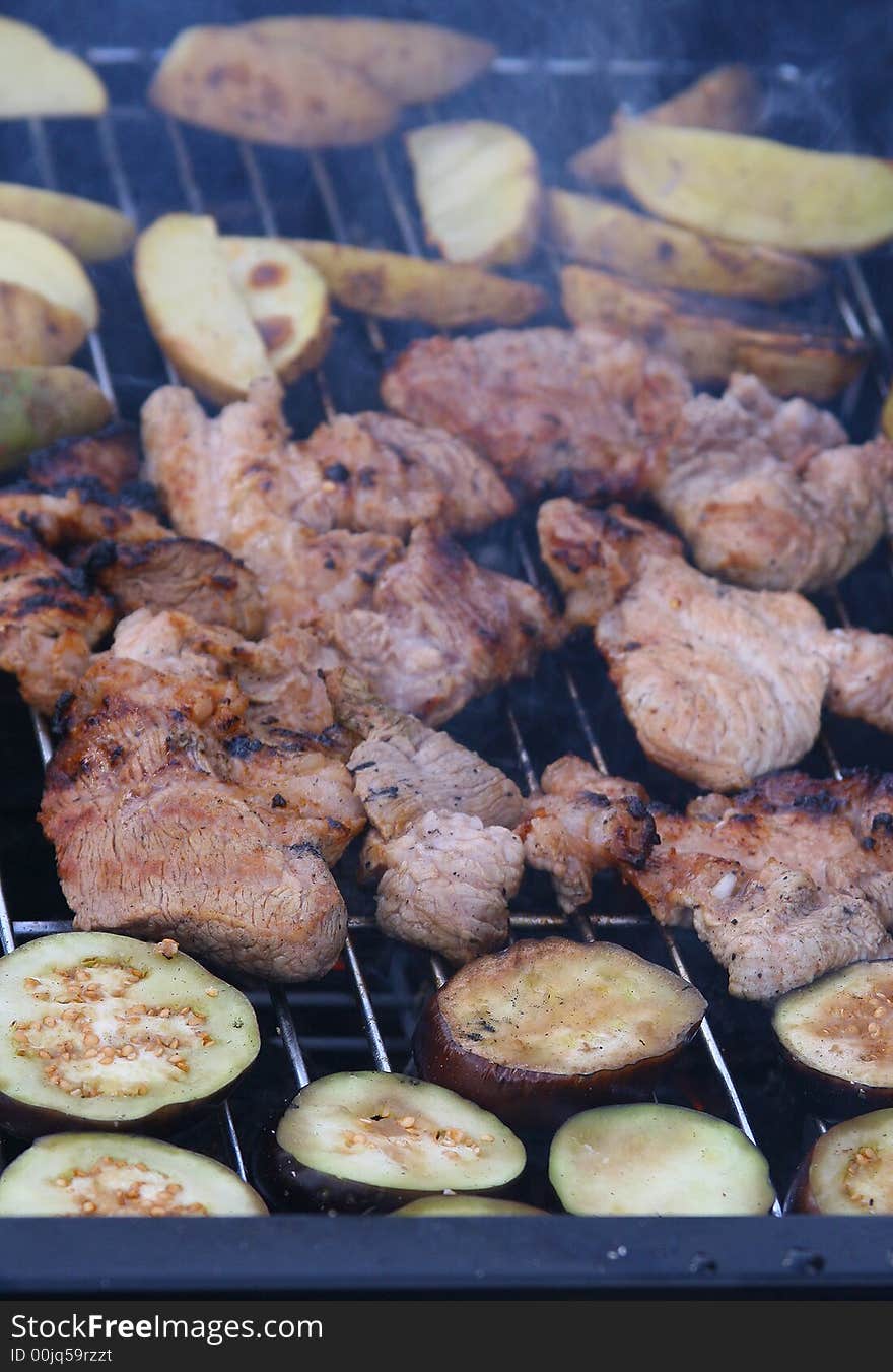 Delicious barbecue grilled meat, potatoes and eggplants