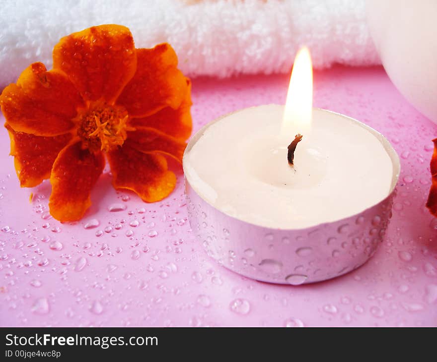 Cream and candle with flowers