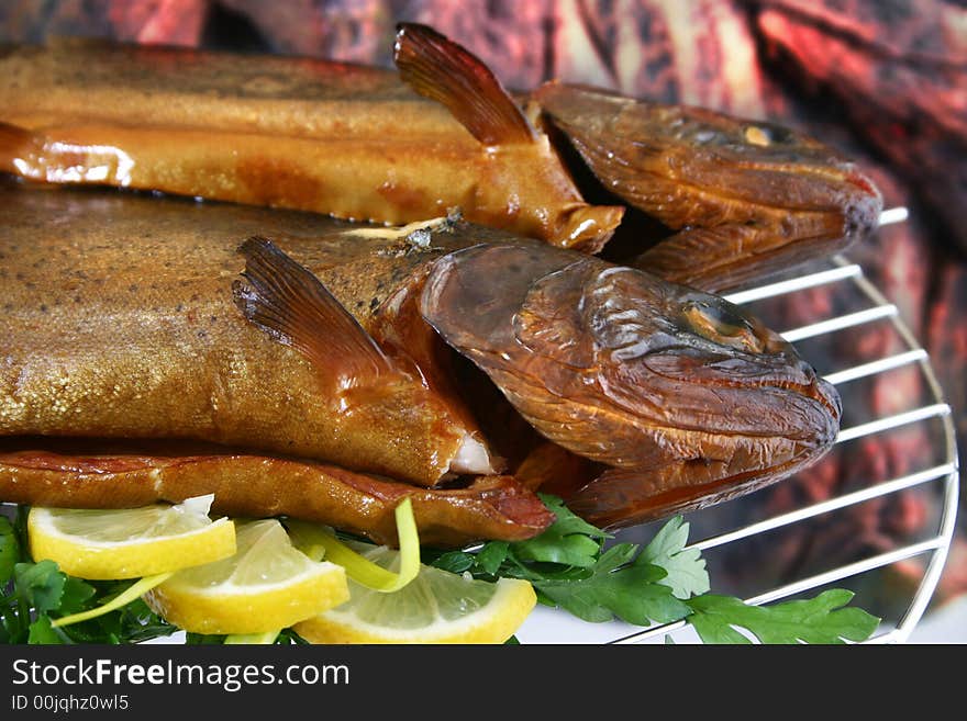 Trouts grilled to perfection and served with lemon and parsley. Trouts grilled to perfection and served with lemon and parsley