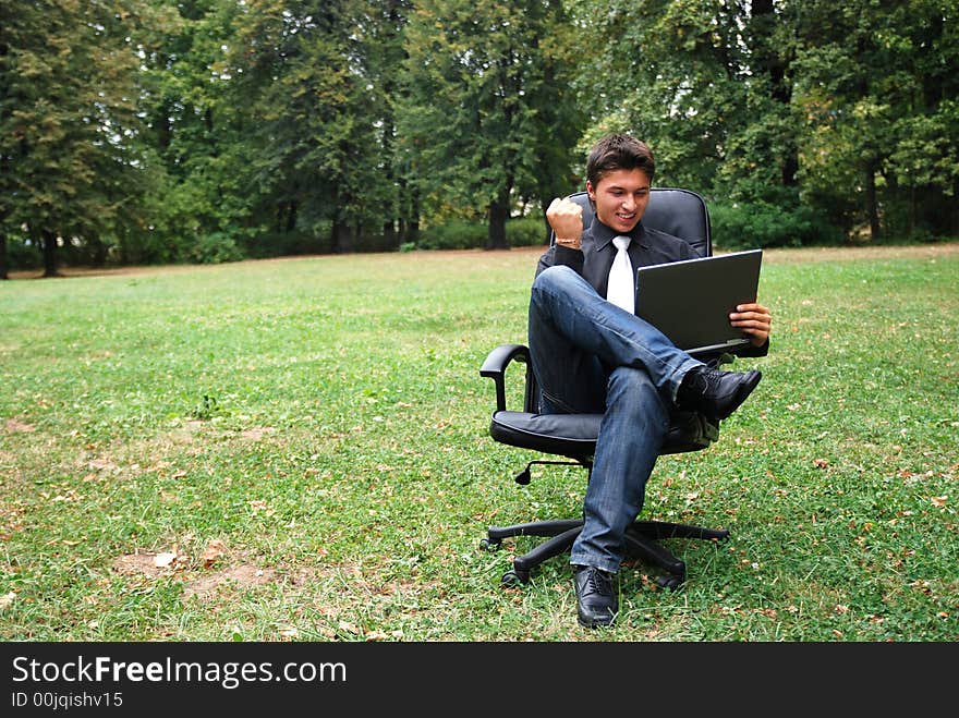 Man working in a field feeling happy about his success. Man working in a field feeling happy about his success