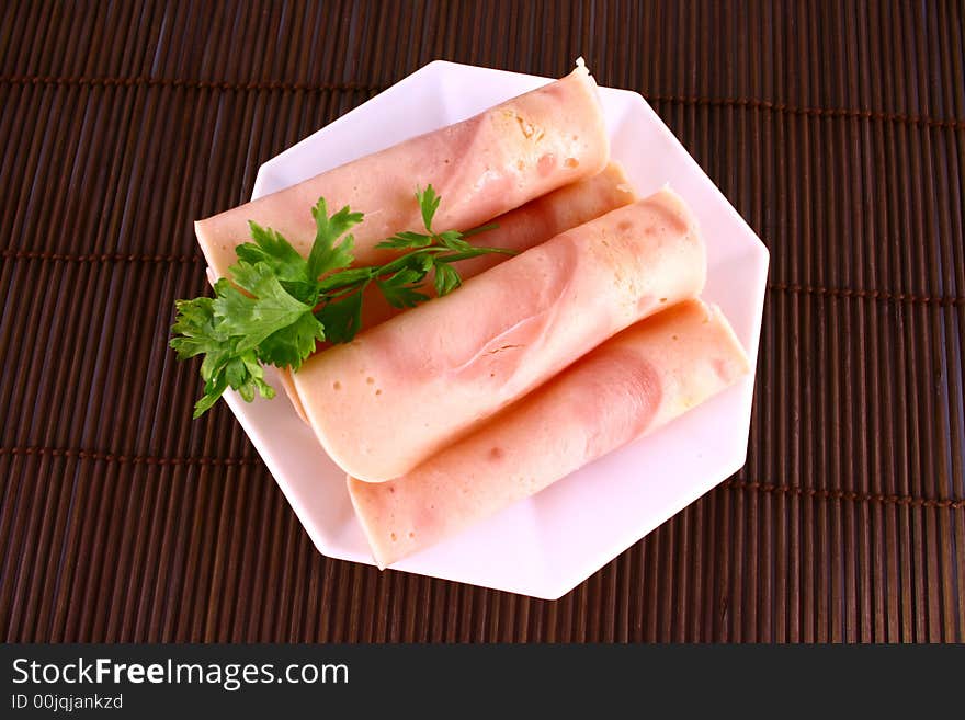 Ham slices on fork with top slice folded