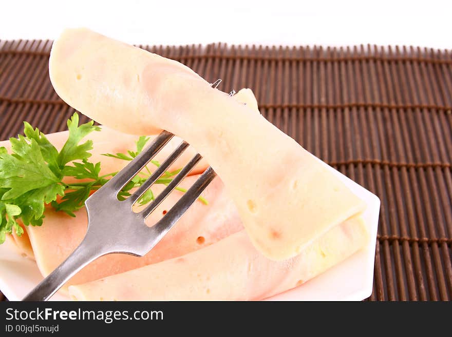 Ham slices on fork with top slice folded