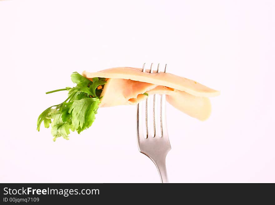 Ham slices on  fork with top slice folded