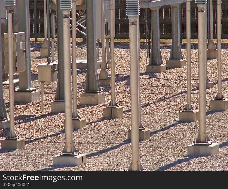 Poles and shadows in an electric substation