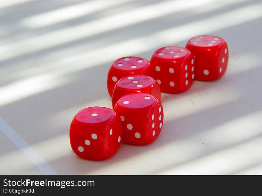 Tempting red dice on table