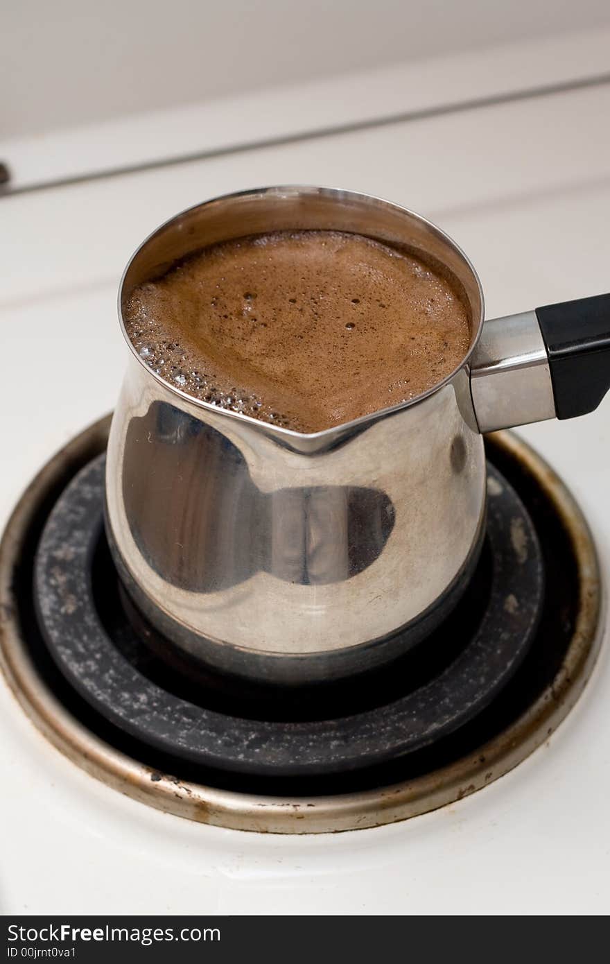 Preparing coffee in metal pot