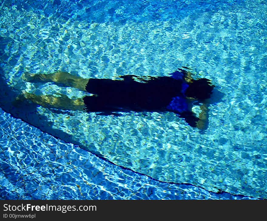 Image of swimmer sleeping in the pool