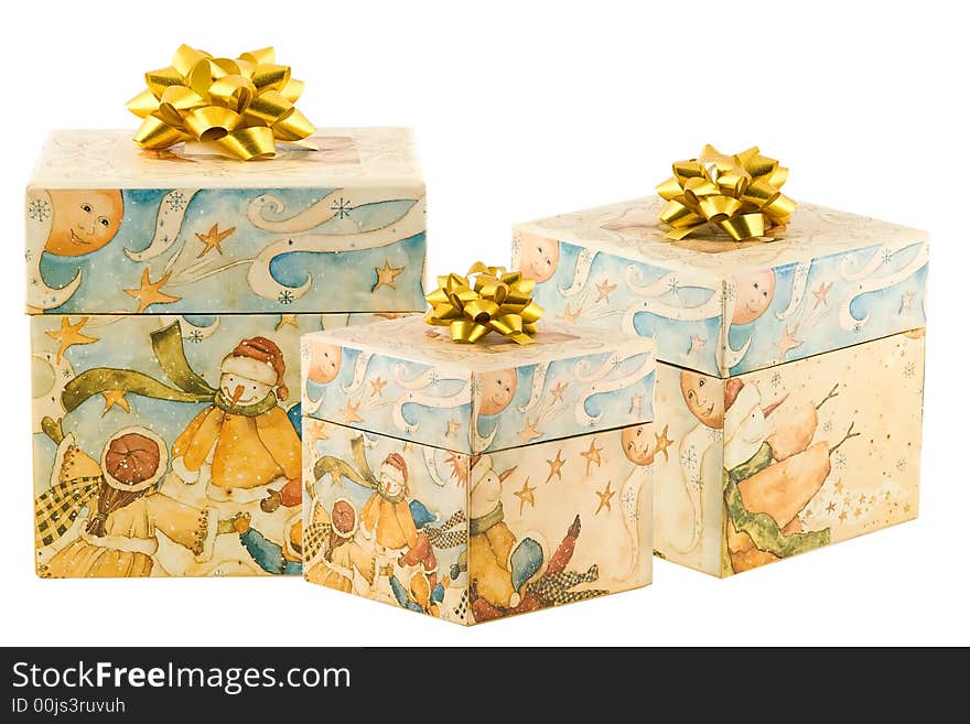 Three presents with gold bows on white