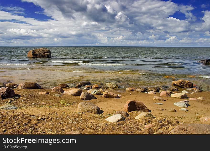 Landscape with blue sky, clouds, stones and sea. Landscape with blue sky, clouds, stones and sea