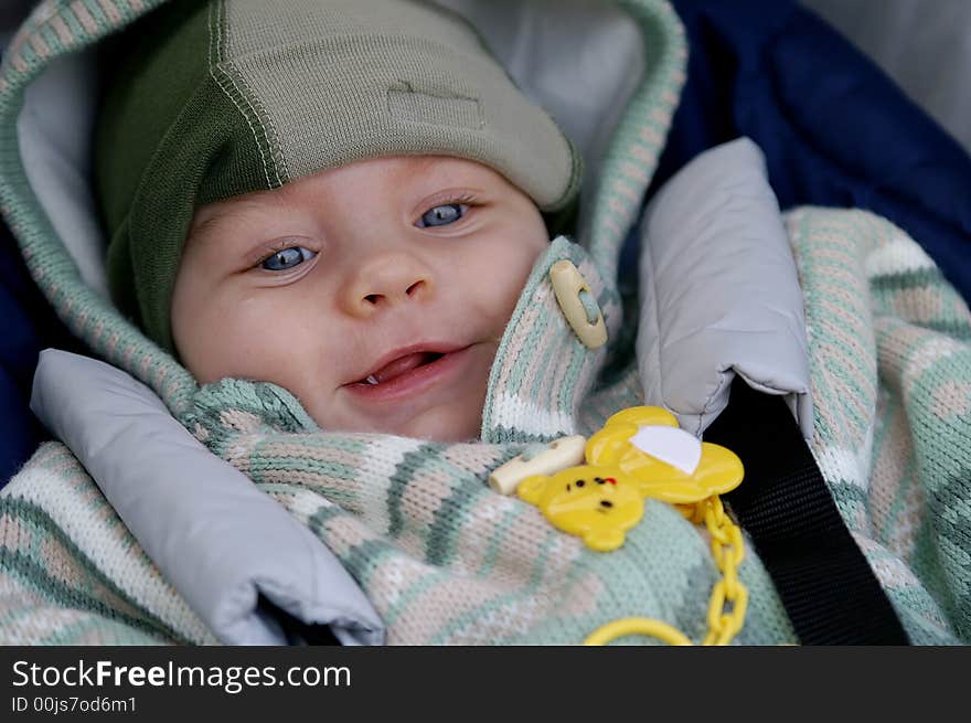 Happy baby infant in his pram