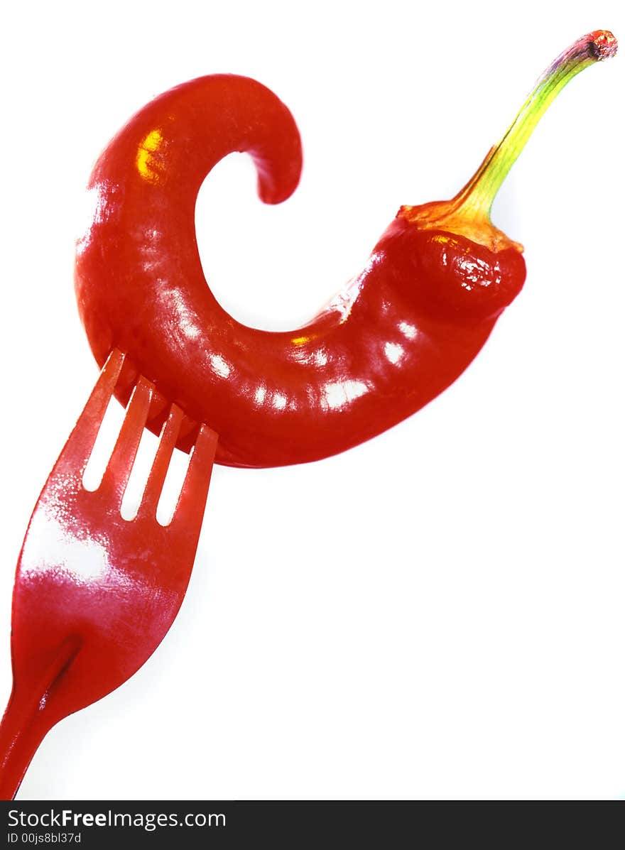 Pepper on a plug on a white background. Pepper on a plug on a white background