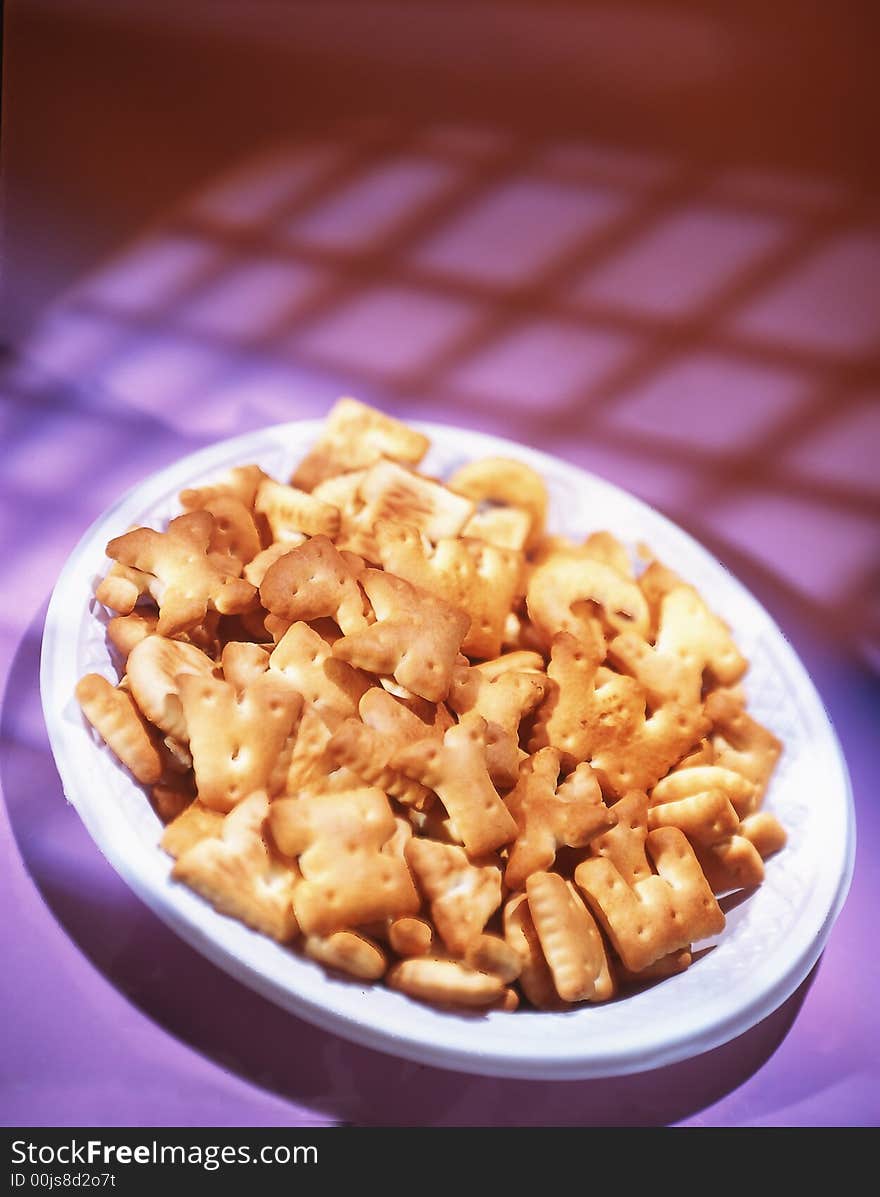 Cookies on a plate on a pink background