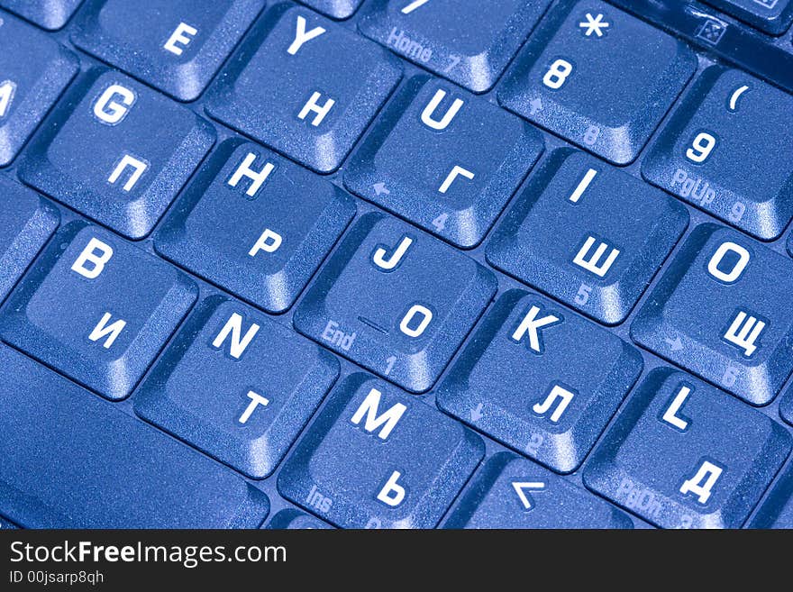 Close-up of computer keyboard in blue