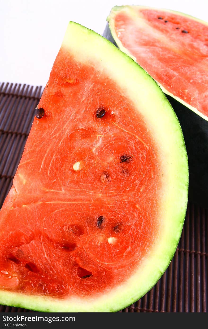 Background of brightly lit red watermelon slices.