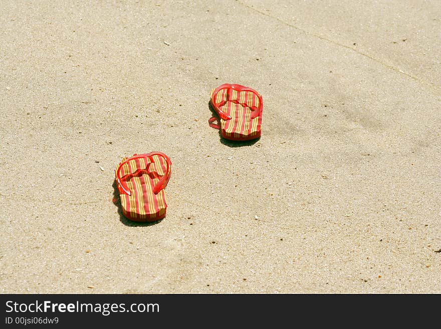 A pair of Flip-flops on the beach