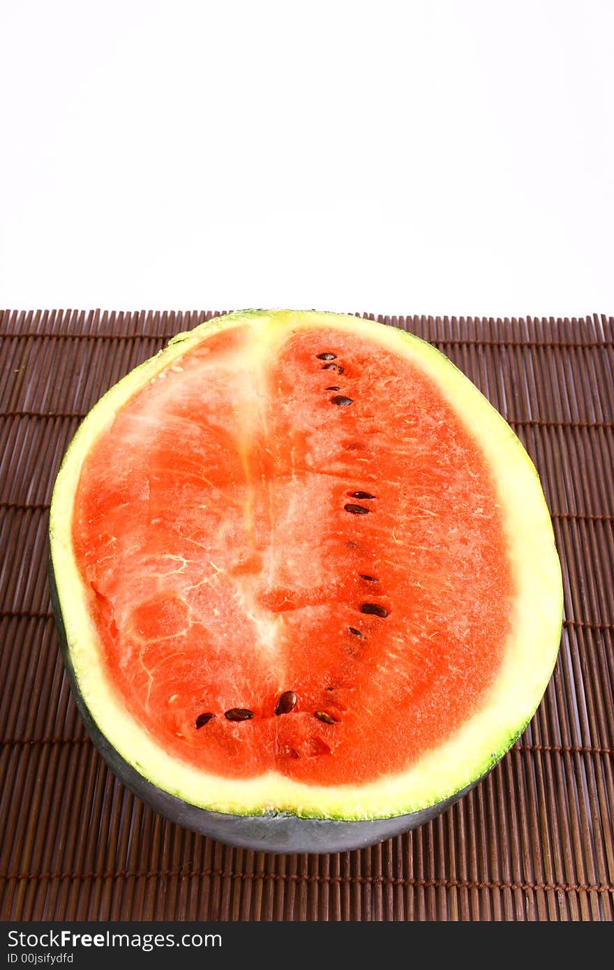 Background of brightly lit red watermelon slices.