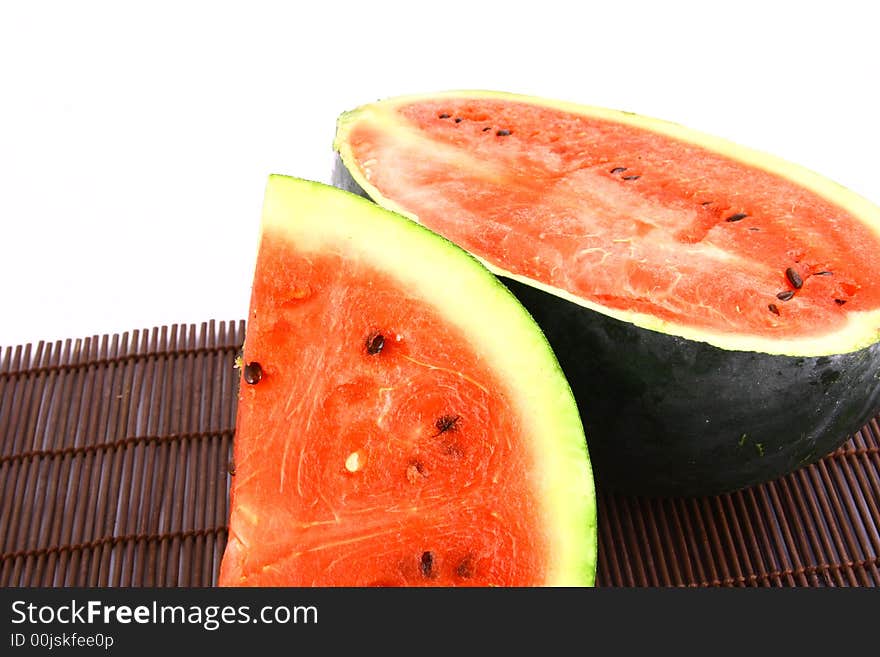 Background of brightly lit red watermelon slices.