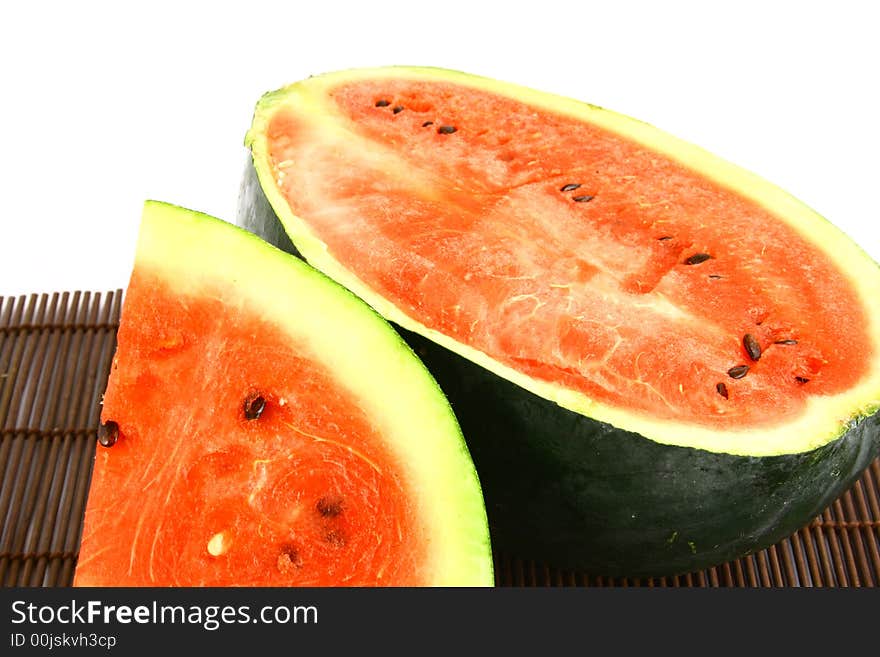 Background of brightly lit red watermelon slices.