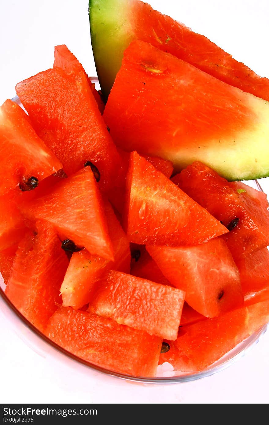 Background of brightly lit red watermelon slices. Background of brightly lit red watermelon slices.