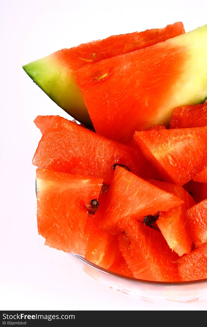 Background of brightly lit red watermelon slices. Background of brightly lit red watermelon slices.