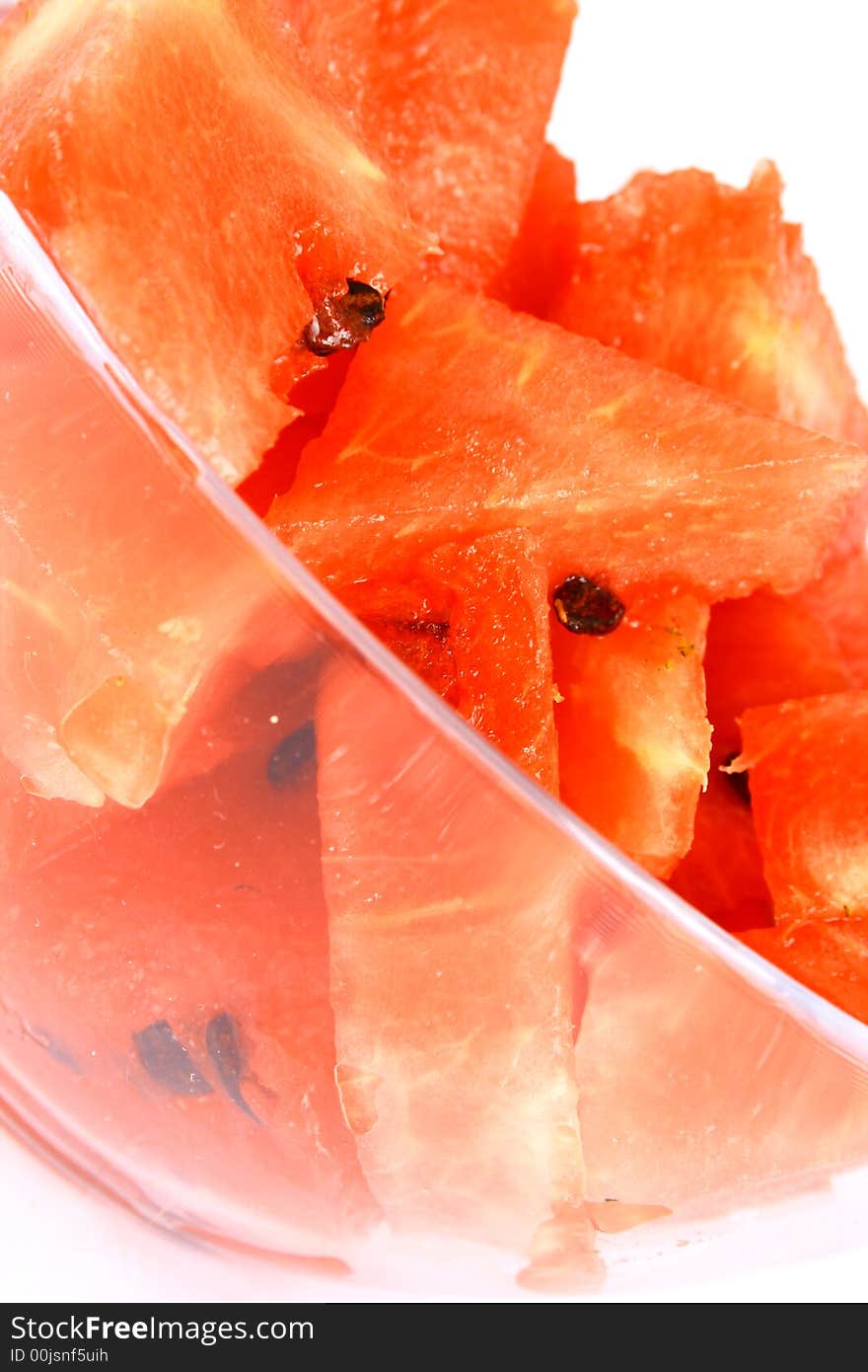 Background of brightly lit red watermelon slices.