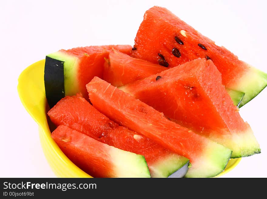 Background of brightly lit red watermelon slices.