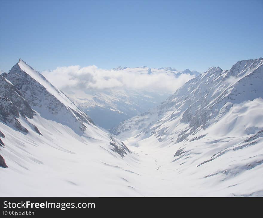 Big snow-covered mountains in the Alps (Italy)