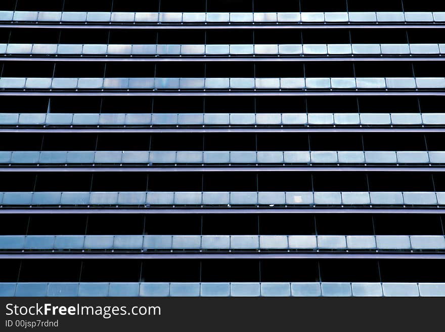 Blue windows of a business building in a row. Blue windows of a business building in a row