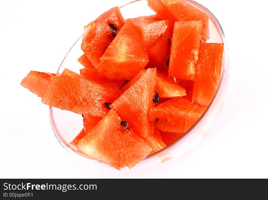 Background of brightly lit red watermelon slices.