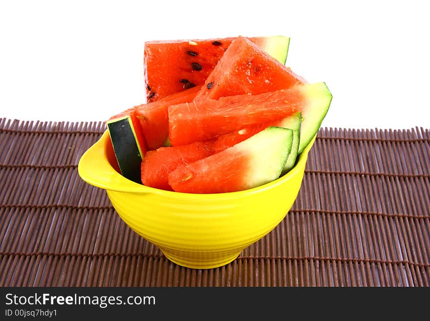 Background of brightly lit red watermelon slices.