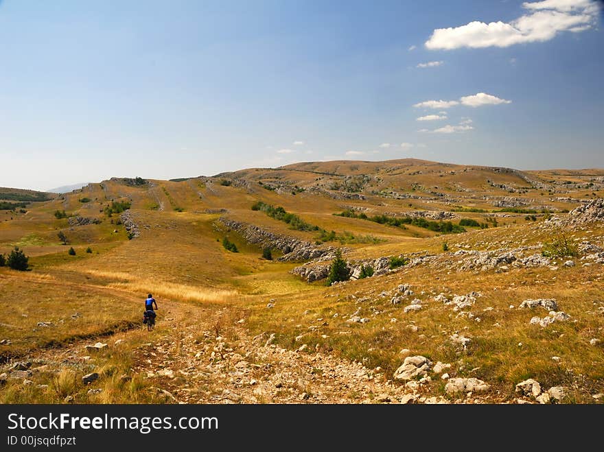 Biker On Mountain Plateau