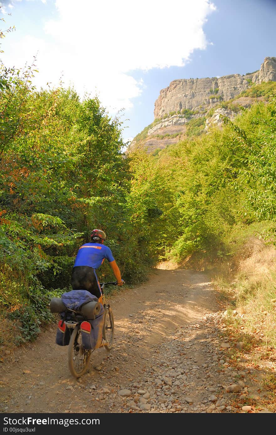 Biker on the mountain road. (Dimerdzhi mountain in Crimea, Ukraine)