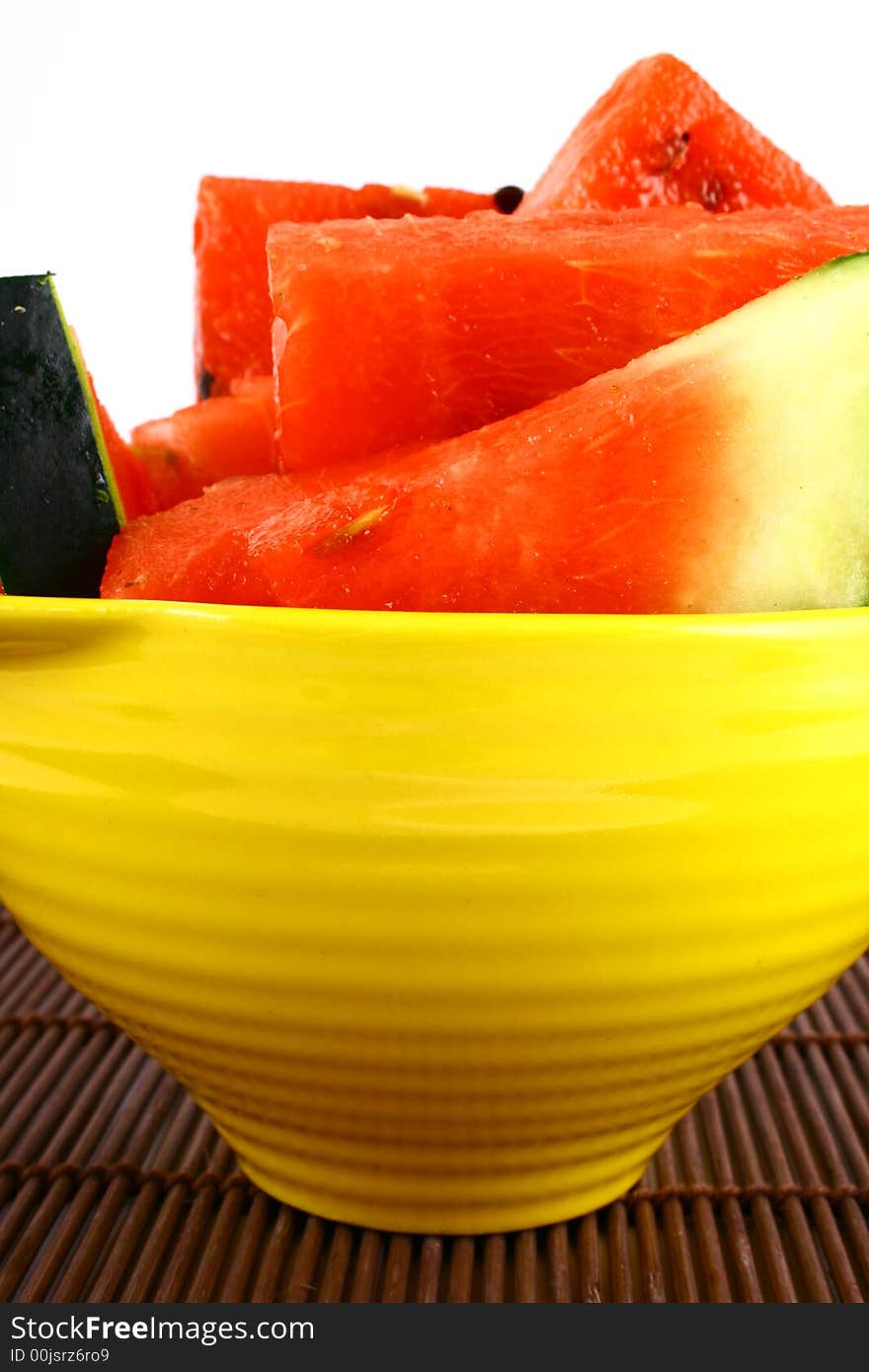 Background of brightly lit red watermelon slices.