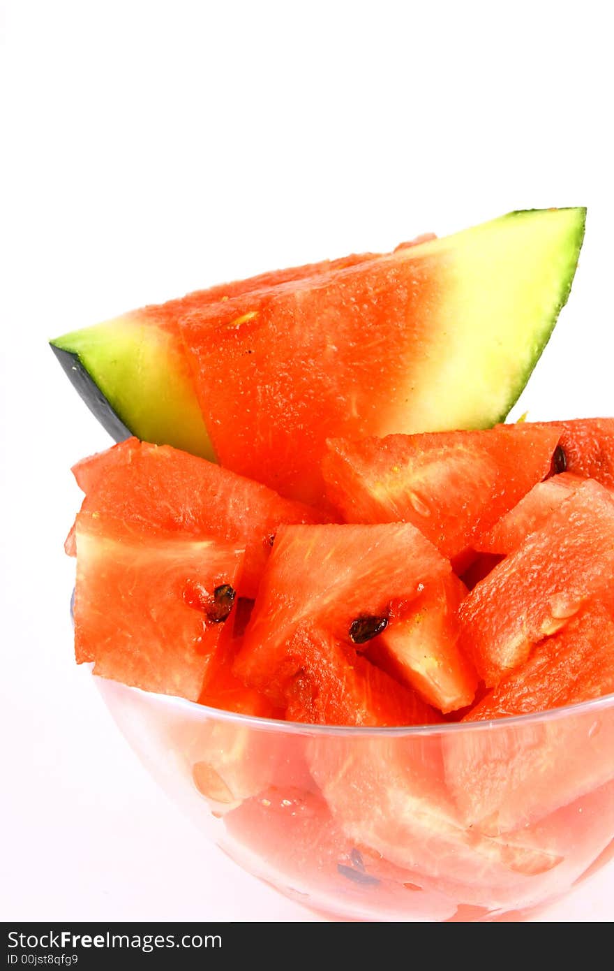 Background of brightly lit red watermelon slices.