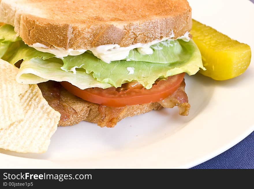 A fresh BLT sandwich with lots of bacon, fresh tomatoes,  lettuce and mayo