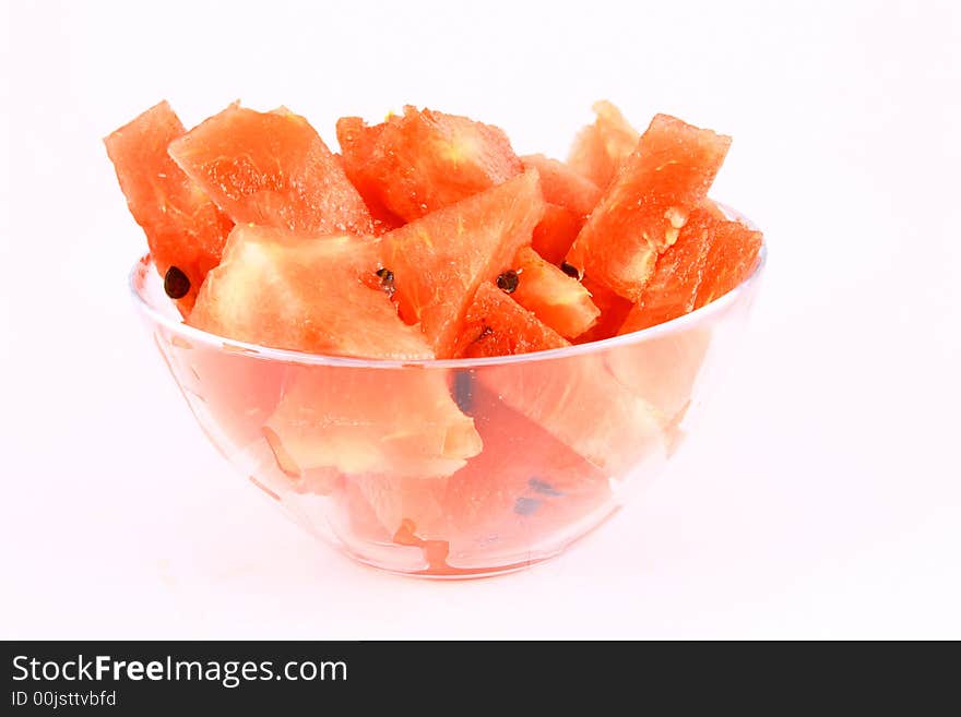 Background of brightly lit red watermelon slices.