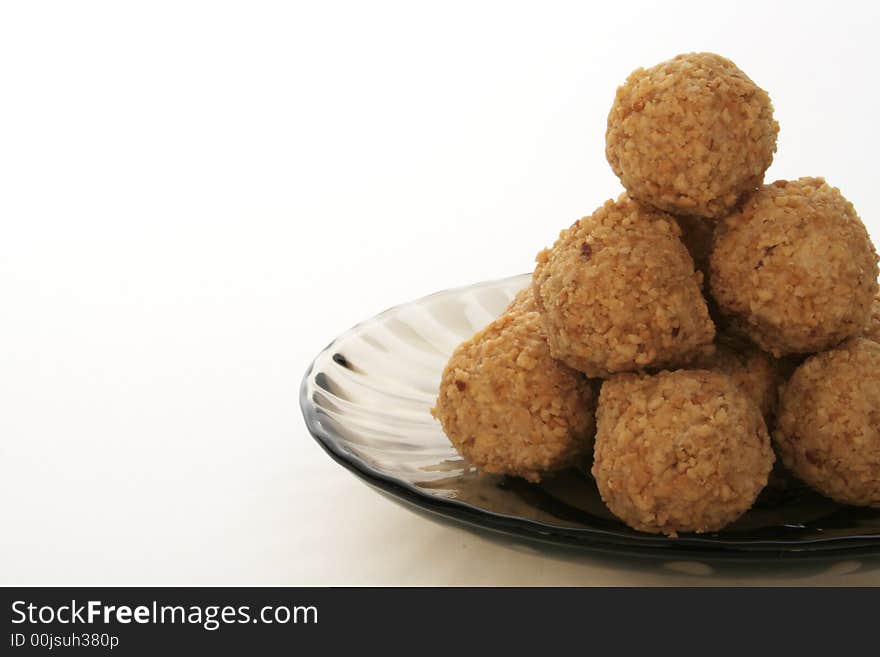 Brown ball cookies isolated on white