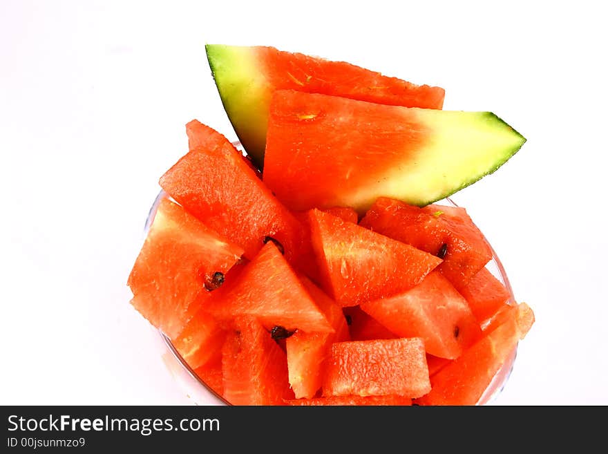 Background of brightly lit red watermelon slices. Background of brightly lit red watermelon slices.