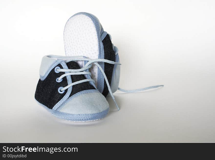 Blue baby footwear isolated on white