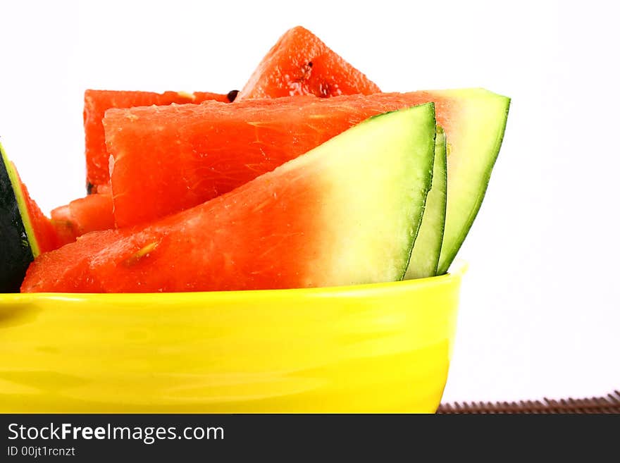 Background of brightly lit red watermelon slices.