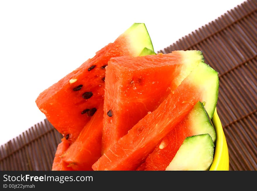 Background of brightly lit red watermelon slices.