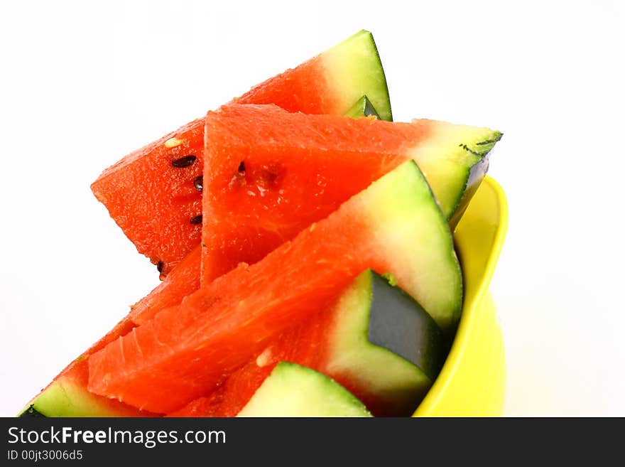 Background of brightly lit red watermelon slices.