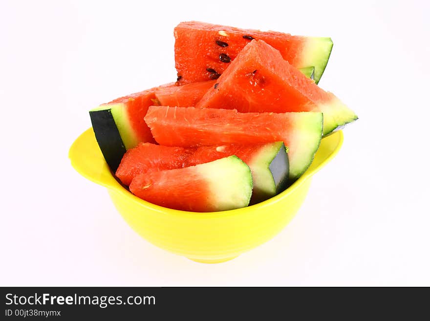 Background of brightly lit red watermelon slices.