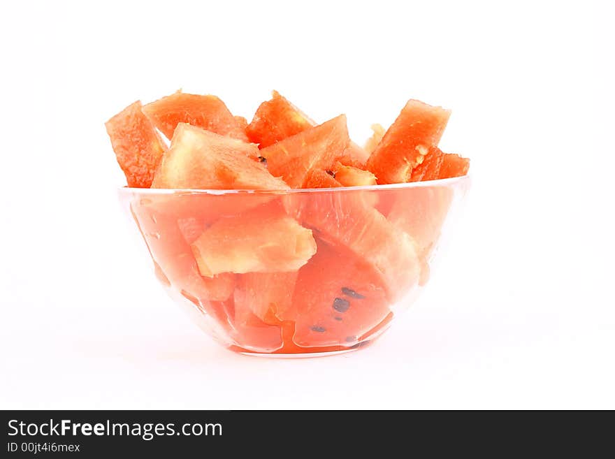 Background of brightly lit red watermelon slices.