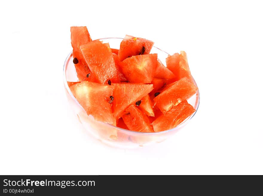 Background of brightly lit red watermelon slices.