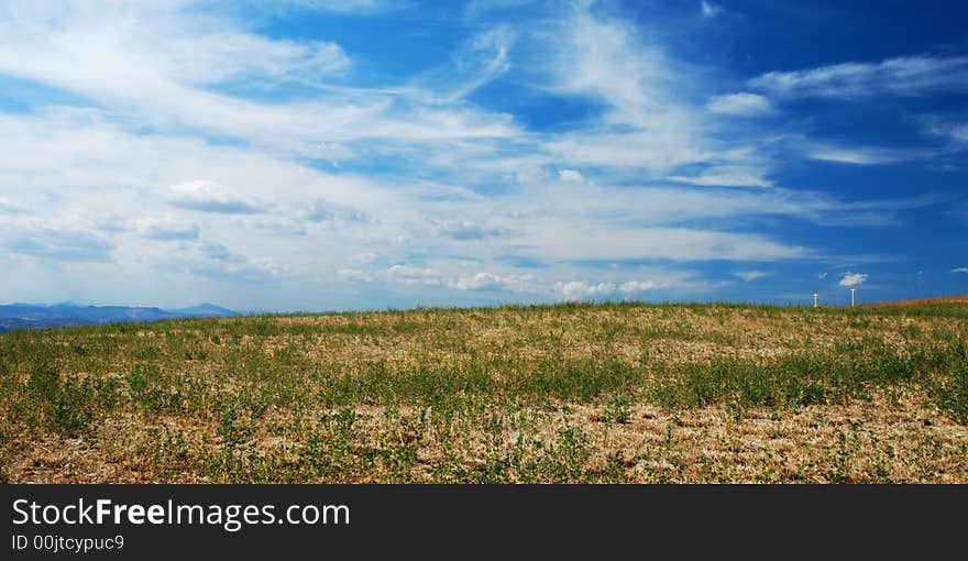 Dramatic cloudy sky over a fresh field. Dramatic cloudy sky over a fresh field