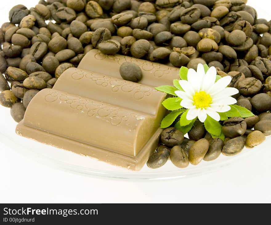 Sweet chocolate and flower on a white background. Sweet chocolate and flower on a white background