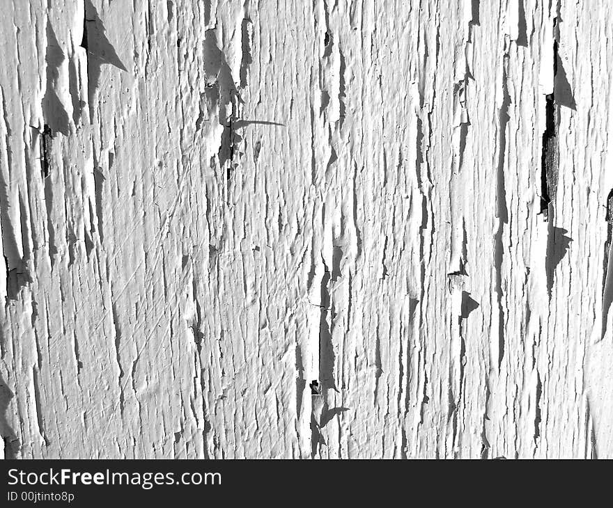 An image of some painted wood that is cracked,it would make an interesting texture background. An image of some painted wood that is cracked,it would make an interesting texture background.