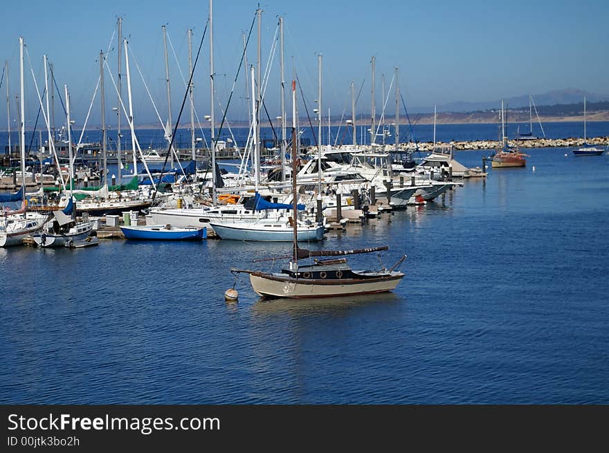 Picture of a sailboat moored in a harbor. Picture of a sailboat moored in a harbor.