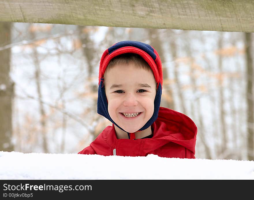 Boy in Winter Wearing Red with a big Smile